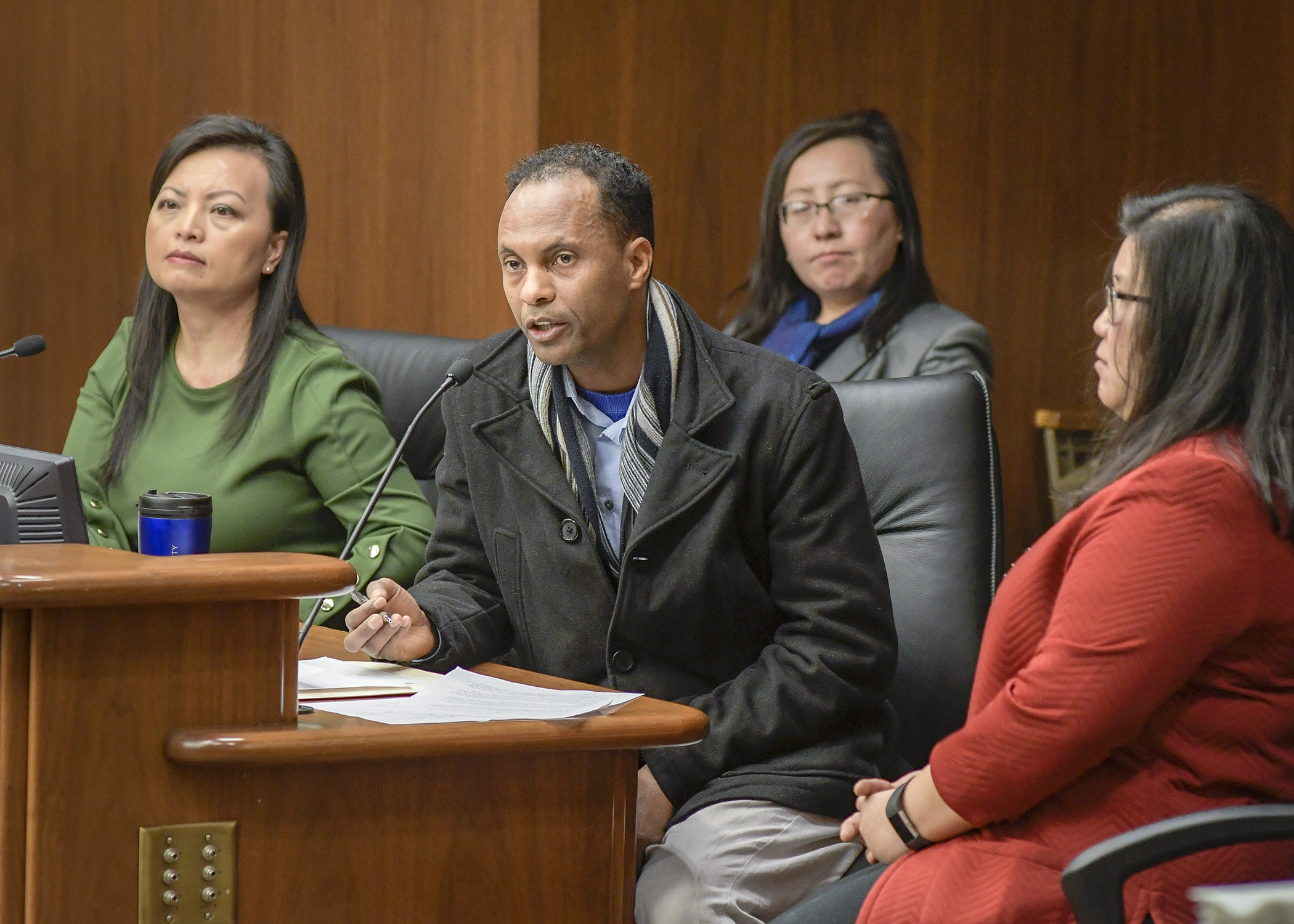 Omar Syed, the parent of an English language learner, testifies before the House Education Finance Division Feb. 6 in support of a bill sponsored by Rep. Kaohly Her, right, to increase funding for ELL programs. Photo by Andrew VonBank